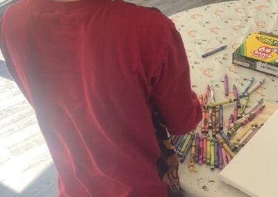 Young Person Busy Melting Coloured Crayons